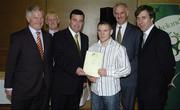 22 May 2006; Brian Lenihan T.D., Minister of State at the Department of Health and Children, 3rd from left, assisted by, from left, Vincent Butler, FAI, Harry McCue, FAI, Martin Quilty, FETAC, and John Delaney, CEO of the Football Association of Ireland, presents a certificate to David Ennis, one of to 24 graduates of the 2005 FÁS/FAI Training Programme. John Paul Park, Cabra, Dublin. Picture credit: Damien Eagers / SPORTSFILE