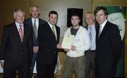 22 May 2006; Brian Lenihan T.D., Minister of State at the Department of Health and Children, 3rd from left, assisted by, from left, Vincent Butler, FAI, Martin Quilty, FETAC, Harry McCue, FAI and John Delaney, CEO of the Football Association of Ireland, presents a certificate to Robbie Gaynor, one of to 24 graduates of the 2005 FÁS/FAI Training Programme. John Paul Park, Cabra, Dublin. Picture credit: Damien Eagers / SPORTSFILE