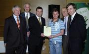 22 May 2006; Brian Lenihan T.D., Minister of State at the Department of Health and Children, 3rd from left, assisted by, from left, Vincent Butler, FAI, Martin Quilty, FETAC, Harry McCue, FAI, and John Delaney, CEO of the Football Association of Ireland, presents a certificate to Dean Kennedy, one of to 24 graduates of the 2005 FÁS/FAI Training Programme. John Paul Park, Cabra, Dublin. Picture credit: Damien Eagers / SPORTSFILE