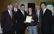 22 May 2006; Brian Lenihan T.D., Minister of State at the Department of Health and Children, 3rd from left, assisted by, from left, Vincent Butler, FAI, Martin Quilty, FETAC, Harry McCue, FAI, and John Delaney, CEO of the Football Association of Ireland, presents a certificate to Gary Mahoney, one of to 24 graduates of the 2005 FÁS/FAI Training Programme. John Paul Park, Cabra, Dublin. Picture credit: Damien Eagers / SPORTSFILE