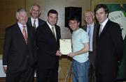 22 May 2006; Brian Lenihan T.D., Minister of State at the Department of Health and Children, 3rd from left, assisted by, from left, Vincent Butler, FAI, Martin Quilty, FETAC, Harry McCue, FAI, and John Delaney, CEO of the Football Association of Ireland, presents a certificate to Alex Murray, one of to 24 graduates of the 2005 FÁS/FAI Training Programme. John Paul Park, Cabra, Dublin. Picture credit: Damien Eagers / SPORTSFILE