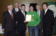 22 May 2006; Brian Lenihan T.D., Minister of State at the Department of Health and Children, 3rd from left, assisted by, from left, Vincent Butler, FAI, Martin Quilty, FETAC, Harry McCue, FAI, and John Delaney, CEO of the Football Association of Ireland, presents a certificate to Paul Olima, one of to 24 graduates of the 2005 FÁS/FAI Training Programme. John Paul Park, Cabra, Dublin. Picture credit: Damien Eagers / SPORTSFILE