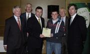 22 May 2006; Brian Lenihan T.D., Minister of State at the Department of Health and Children, 3rd from left, assisted by, from left, Vincent Butler, FAI, Martin Quilty, FETAC, Harry McCue, FAI, and John Delaney, CEO of the Football Association of Ireland, presents a certificate to Derek Prendergast, one of to 24 graduates of the 2005 FÁS/FAI Training Programme. John Paul Park, Cabra, Dublin. Picture credit: Damien Eagers / SPORTSFILE