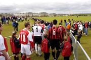 28 May 2006; St. Patrick's Athletic and Malahide United players walk out onto the pitch for the start of the game. FAI Carlsberg Cup, 2nd Round, Malahide United v St. Patrick's Athletic, Gannon Park, Malalhide, Dublin. Picture credit: David Maher / SPORTSFILE