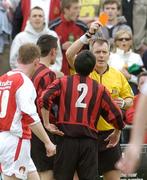 28 May 2006; Referee Hugo Whoriskey, shows the red card to Mark Cromwell, 2, Malahide United. FAI Carlsberg Cup, 2nd Round, Malahide United v St. Patrick's Athletic, Gannon Park, Malalhide, Dublin. Picture credit: David Maher / SPORTSFILE