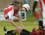 28 May 2006; John Frost, St. Patrick's Athletic, in action against Neil Beasley, Malahide United. FAI Carlsberg Cup, 2nd Round, Malahide United v St. Patrick's Athletic, Gannon Park, Malalhide, Dublin. Picture credit: David Maher / SPORTSFILE