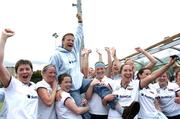 28 May 2006; Hermes coach Rudi Worthmann is lifted by his team after defeating Pegasus in the ESB All-Ireland Women's Club Championship Final, Hermes v Pegasus, Belfield, UCD, Dublin. Picture credit: Ray Lohan / SPORTSFILE