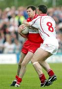 28 May 2006; Colin Holmes, Tyrone, in action against Enda Muldoon, Derry. Bank of Ireland Ulster Senior Football Championship, Round 1, Tyrone v Derry, Healy Park, Omagh, Co. Tyrone. Picture credit; Oliver McVeigh / SPORTSFILE