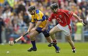 28 May 2006; Sean Arthur, Clare, in action against Timmy Lordan, Cork. Munster Intermediate Hurling Championship, Semi-final, Clare v Cork, Semple Stadium, Thurles, Co. Tipperary. Picture credit; Brendan Moran / SPORTSFILE