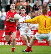 28 May 2006; Nial Mc Nicholl, Derry, in action against Michael O'Neill and Aidan Gavin, Tyrone. ESB Ulster Minor Football Championship, Quarter Final, Tyrone v Derry, Healy Park, Omagh, Co. Tyrone. Picture credit; Oliver McVeigh / SPORTSFILE