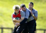 30 May 2006; Andrew Trimble is tackled by Anthony Foley and Jeremy Staunton during Ireland Rugby squad training. University of Limerick, Limerick. Picture credit; Brendan Moran / SPORTSFILE