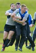 30 May 2006; Gavin Duffy is tackled by Jeremy Staunton, left, and Anthony Foley during Ireland Rugby squad training. University of Limerick, Limerick. Picture credit; Brendan Moran / SPORTSFILE
