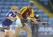 31 May 2006; Stephen Nolan, Wexford, in action against Cahir Healy, Laois. Leinster U21 Hurling Championship, Laois v Wexford, O'Moore Park, Portlaoise, Co. Laois. Picture credit: Pat Murphy / SPORTSFILE
