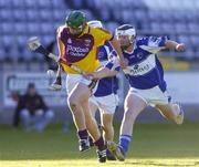 31 May 2006; Richie Keogh, Wexford, in action against John Rowney, Laois. Leinster U21 Hurling Championship, Laois v Wexford, O'Moore Park, Portlaoise, Co. Laois. Picture credit: Pat Murphy / SPORTSFILE