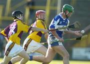 31 May 2006; Brendan McEvoy, Laois, in action against Nick Kirwan, left, and Alan Griffith, Wexford. Leinster U21 Hurling Championship, Laois v Wexford, O'Moore Park, Portlaoise, Co. Laois. Picture credit: Pat Murphy / SPORTSFILE