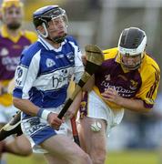 31 May 2006; Michael Kinsella, Wexford, in action against Zane Keenan, Laois. Leinster U21 Hurling Championship, Laois v Wexford, O'Moore Park, Portlaoise, Co. Laois. Picture credit: Pat Murphy / SPORTSFILE