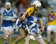 31 May 2006; Zane Keenan, Laois, in action against Brian Malone, Wexford. Leinster U21 Hurling Championship, Laois v Wexford, O'Moore Park, Portlaoise, Co. Laois. Picture credit: Pat Murphy / SPORTSFILE