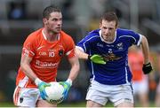 8 June 2014; Eugene McVerry, Armagh, in action against Jason McLaughlin, Cavan. Ulster GAA Football Senior Championship, Quarter-Final, Armagh v Cavan, Athletic Grounds, Armagh. Picture credit: Ramsey Cardy / SPORTSFILE