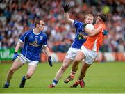 8 June 2014; Stefan Campbell, Armagh, in action against Martin Reilly and James McEnroe, Cavan. Ulster GAA Football Senior Championship, Quarter-Final, Armagh v Cavan, Athletic Grounds, Armagh. Picture credit: Oliver McVeigh / SPORTSFILE