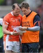 8 June 2014; Armagh assistant manager Kieran McGeeney, right, speaks with Ciaran McKeever before the match. Ulster GAA Football Senior Championship, Quarter-Final, Armagh v Cavan, Athletic Grounds, Armagh. Picture credit: Ramsey Cardy / SPORTSFILE