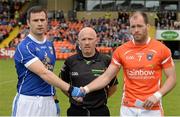 8 June 2014; Armagh captain Ciaran McKeever, right, and Cavan captain Alan Clarke with referee Marty Duffy at the hand shake before the game. Ulster GAA Football Senior Championship, Quarter-Final, Armagh v Cavan, Athletic Grounds, Armagh. Picture credit: Oliver McVeigh / SPORTSFILE