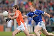 8 June 2014; Kevin Dyas, Armagh, in action against James McEnroe, Cavan. Ulster GAA Football Senior Championship, Quarter-Final, Armagh v Cavan, Athletic Grounds, Armagh. Picture credit: Oliver McVeigh / SPORTSFILE