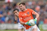 8 June 2014; Eugene McVerry, Armagh, in action against Alan Clarke, Cavan. Ulster GAA Football Senior Championship, Quarter-Final, Armagh v Cavan, Athletic Grounds, Armagh. Picture credit: Oliver McVeigh / SPORTSFILE