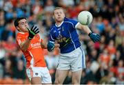 8 June 2014; Stefan Campbell, Armagh, in action against James McEnroe, Cavan. Ulster GAA Football Senior Championship, Quarter-Final, Armagh v Cavan, Athletic Grounds, Armagh. Picture credit: Oliver McVeigh / SPORTSFILE