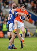 8 June 2014; Andy Mallon, Armagh, in action against Killian Brady, Cavan. Ulster GAA Football Senior Championship, Quarter-Final, Armagh v Cavan, Athletic Grounds, Armagh. Picture credit: Oliver McVeigh / SPORTSFILE