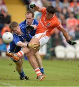 8 June 2014; Stefan Campbell, Armagh, has his shot blocked by Rory Dunne and Martin Reilly, Cavan. Ulster GAA Football Senior Championship, Quarter-Final, Armagh v Cavan, Athletic Grounds, Armagh. Picture credit: Oliver McVeigh / SPORTSFILE