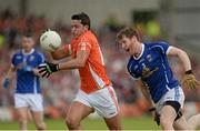 8 June 2014; Stefan Campbell, Armagh, in action against Rory Dunne, Cavan. Ulster GAA Football Senior Championship, Quarter-Final, Armagh v Cavan, Athletic Grounds, Armagh. Picture credit: Oliver McVeigh / SPORTSFILE