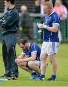 8 June 2014; A dejected Fergal Flanagan and Cian Mackey, Cavan, after the game. Ulster GAA Football Senior Championship, Quarter-Final, Armagh v Cavan, Athletic Grounds, Armagh. Picture credit: Oliver McVeigh / SPORTSFILE