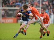 8 June 2014; Robert Maloney Derham, Cavan, in action against Kieran Toner and Eugene McVerry, Armagh. Ulster GAA Football Senior Championship, Quarter-Final, Armagh v Cavan, Athletic Grounds, Armagh. Picture credit: Oliver McVeigh / SPORTSFILE