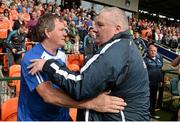 8 June 2014; Cavan manager Terry Hyland and Armagh manager Paul Grimley embrace at the end of the game. Ulster GAA Football Senior Championship, Quarter-Final, Armagh v Cavan, Athletic Grounds, Armagh. Picture credit: Oliver McVeigh / SPORTSFILE