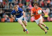 8 June 2014; Kevin Dyas, Armagh, in action against James McEnroe, Cavan. Ulster GAA Football Senior Championship, Quarter-Final, Armagh v Cavan, Athletic Grounds, Armagh. Picture credit: Oliver McVeigh / SPORTSFILE