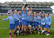 9 June 2014; Scoil San Treasa, Mount Merrion, Dublin, captain Sadhbh Quinlan lifts the cup with her team-mates after the game. Allianz Cumann na mBunscol Football Finals, Croke Park, Dublin. Picture credit: Barry Cregg / SPORTSFILE