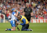 8 June 2014; Michael Walsh, Waterford, is treated for a hand injury. Munster GAA Hurling Senior Championship, Quarter-Final Replay, Cork v Waterford, Semple Stadium, Thurles, Co. Tipperary. Picture credit: Piaras Ó Mídheach / SPORTSFILE