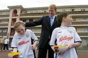 30 May 2006; Republic of Ireland International Manager Steve Staunton with Jason Quinn, left, aged 11 and Richy McCarthy, aged 11, both from Balllybough, at the launch of the FAI Inner City Futsal Programme, sponsored by Kellogg's. Futsal is the official UEFA and FIFA version of 5 a side football. Ballybough House, Ballybough, Dublin. Picture credit: David Maher / SPORTSFILE