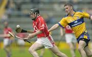 28 May 2006; Maurice O'Sullivan, Cork, in action against Aidan Quilligan, Clare. Munster Intermediate Hurling Championship, Semi-final, Clare v Cork, Semple Stadium, Thurles, Co. Tipperary. Picture credit; Brendan Moran / SPORTSFILE