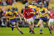 28 May 2006; Rory Doherty, Cork, in action against Michael Hawes, Clare. Munster Intermediate Hurling Championship, Semi-final, Clare v Cork, Semple Stadium, Thurles, Co. Tipperary. Picture credit; Brendan Moran / SPORTSFILE