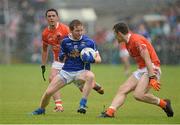 8 June 2014; Jack Brady, Cavan, in action against Stefan Campbell and Brendan Donaghy, Armagh. Ulster GAA Football Senior Championship, Quarter-Final, Armagh v Cavan, Athletic Grounds, Armagh. Picture credit: Oliver McVeigh / SPORTSFILE