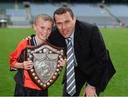 10 June 2014; Conor Baldwin a member of the victorious St Brigid'd Boys National School, Killester, Dublin, who were presented with the Marino Shield is photographed with his uncle the former Dublin star Ciaran Whelan after the game. Allianz Cumann na mBunscol Football Finals, Croke Park, Dublin. Picture credit: Ray McManus / SPORTSFILE