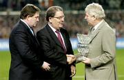 18 February 2004; Former MLA John Hume, centre, receives a presentation from Milo Corcoran, right, President of the Football Association of Ireland and Football Association of Ireland Chief Executive Fran Rooney for his contribution to politics during half-time of the International Friendly between the Republic of Ireland and Brazil at Lansdowne Road in Dublin. Photo by Brendan Moran/Sportsfile