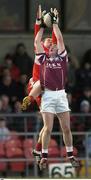 22 February 2004; Damien Cunniffe of Caltra in action against Ronan Rocks of the Loup during the AIB All-Ireland Senior Club Football Championship Semi-Final match between Caltra and Loup at Markievicz Park in Sligo. Photo by Damien Eagers/Sportsfile