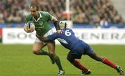 14 February 2004; Keith Gleeson of Ireland is tackled by Serge Betsen of France during the RBS Six Nations Rugby Championship match between France and Ireland at Stade de France in Paris, France. Photo by Brendan Moran/Sportsfile