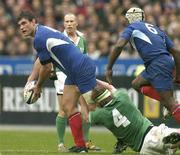 14 February 2004; Fabien Pelous of France is tackled by Malcolm O'Kelly of Ireland during the RBS Six Nations Rugby Championship match between France and Ireland at Stade de France in Paris, France. Photo by Brendan Moran/Sportsfile