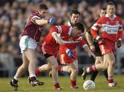 22 February 2004; John Young of the Loup in action against Kevin Gavin of Caltra during the AIB All-Ireland Senior Club Football Championship Semi-Final match between Caltra and Loup at Markievicz Park in Sligo. Photo by Damien Eagers/Sportsfile