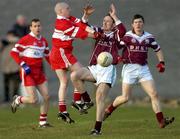 22 February 2004; Brian Laffey of Caltra in action against Fintan Martin of the Loup during the AIB All-Ireland Senior Club Football Championship Semi-Final match between Caltra and Loup at Markievicz Park in Sligo. Photo by Damien Eagers/Sportsfile