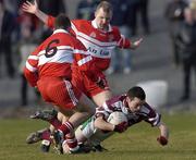 22 February 2004; Oisin Kelly of Caltra in action against Padraig O'Kane and Johnny McBride of the Loup during the AIB All-Ireland Senior Club Football Championship Semi-Final match between Caltra and Loup at Markievicz Park in Sligo. Photo by Damien Eagers/Sportsfile