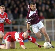 22 February 2004; Tomás Meehan of Caltra in action against Fintan Martin of the Loup during the AIB All-Ireland Senior Club Football Championship Semi-Final match between Caltra and Loup at Markievicz Park in Sligo. Photo by Damien Eagers/Sportsfile